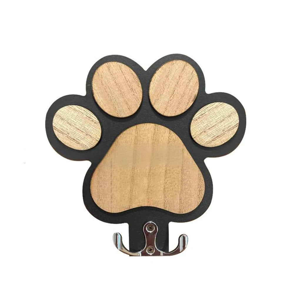 Crochet mural en bois avec motif de patte pour laisse de chien, idéal pour les colliers et les manteaux.